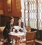 Two women having discussion sharing notes